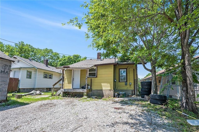 1409 N 24th St, Kansas City, KS 66102 - view of front of house with a chimney
