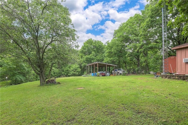 25801 E 317th Ter, Harrisonville, MO 64701 - view of green lawn featuring a detached carport