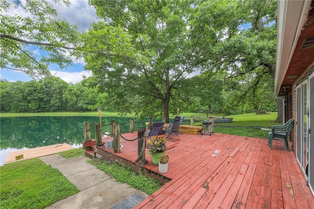 25801 E 317th Ter, Harrisonville, MO 64701 - wooden terrace with a water view, view of wooded area, and a lawn
