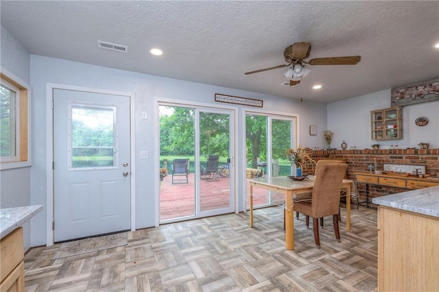 25801 E 317th Ter, Harrisonville, MO 64701 - dining space featuring a ceiling fan, a textured ceiling, and recessed lighting