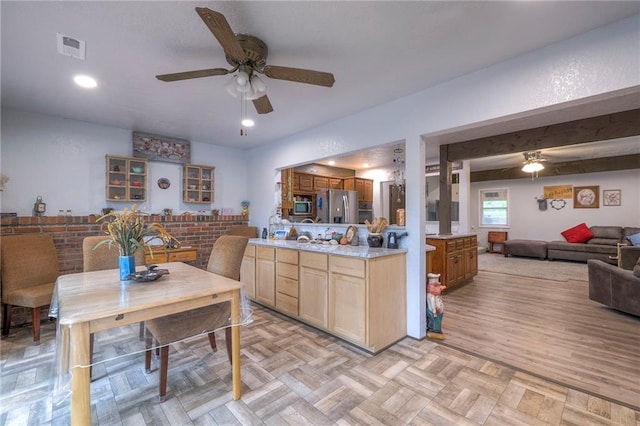 25801 E 317th Ter, Harrisonville, MO 64701 - kitchen with ceiling fan, stainless steel appliances, open floor plan, and light countertops