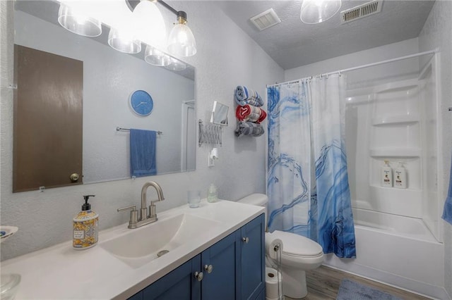 25801 E 317th Ter, Harrisonville, MO 64701 - full bathroom with vanity, toilet, wood finished floors, a textured ceiling, and shower / bath combination with curtain