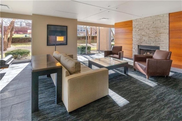 600 E 8th St Unit 6N, Kansas City, MO 64106 - living area featuring an outdoor stone fireplace