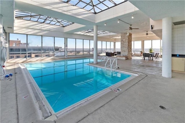 600 E 8th St Unit 6N, Kansas City, MO 64106 - indoor pool featuring a patio, a ceiling fan, a lanai, and outdoor dining area