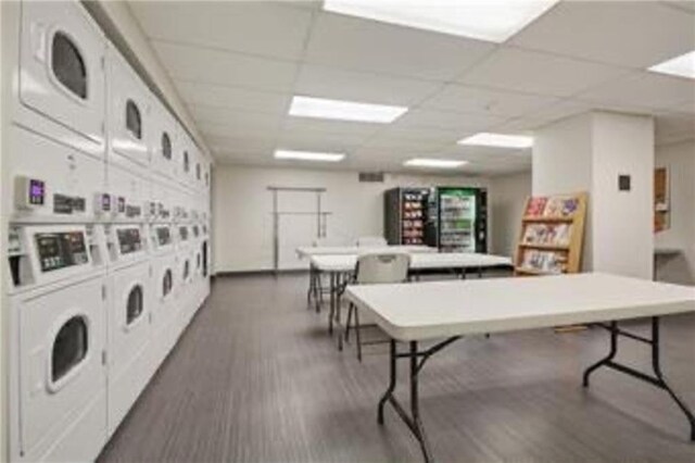 600 E 8th St Unit 6N, Kansas City, MO 64106 - community laundry with stacked washer / drying machine, dark wood finished floors, and independent washer and dryer