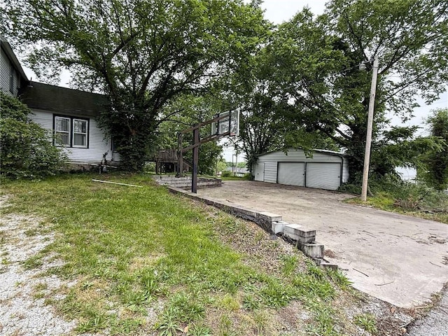 1202 Wall St, Galena, KS 66739 - view of grassy yard with an outdoor structure and a detached garage