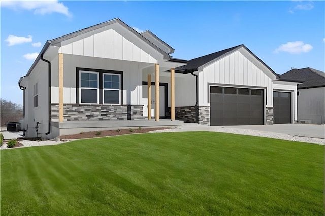 805 W Solomon Dr, Lone Jack, MO 64086 - modern farmhouse style home featuring a garage, a front yard, concrete driveway, and board and batten siding