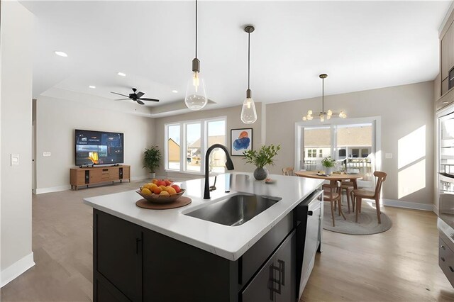 805 W Solomon Dr, Lone Jack, MO 64086 - kitchen with a sink, light countertops, healthy amount of natural light, dark cabinets, and recessed lighting