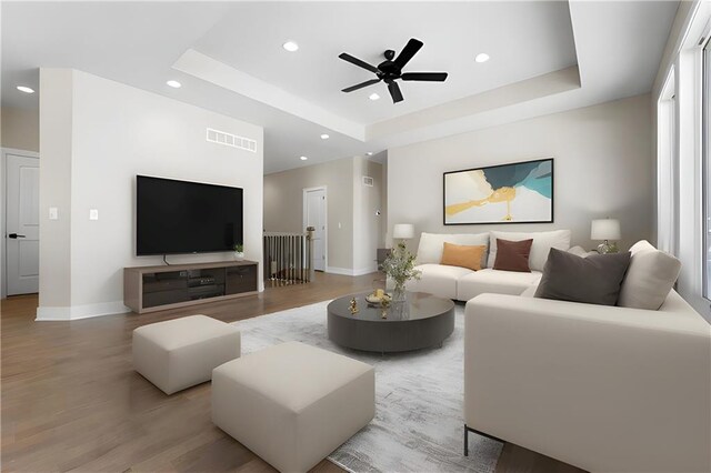 805 W Solomon Dr, Lone Jack, MO 64086 - living area featuring a tray ceiling, light wood finished floors, baseboards, recessed lighting, and ceiling fan