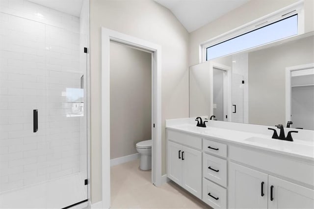 805 W Solomon Dr, Lone Jack, MO 64086 - full bathroom featuring double vanity, a shower stall, toilet, and baseboards