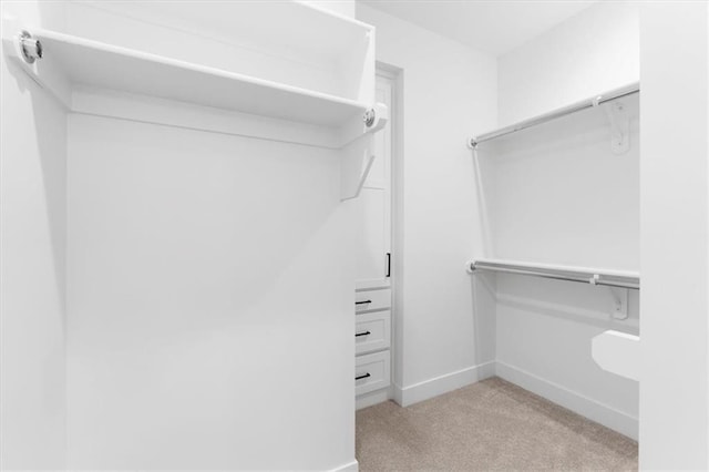 805 W Solomon Dr, Lone Jack, MO 64086 - walk in closet featuring light colored carpet