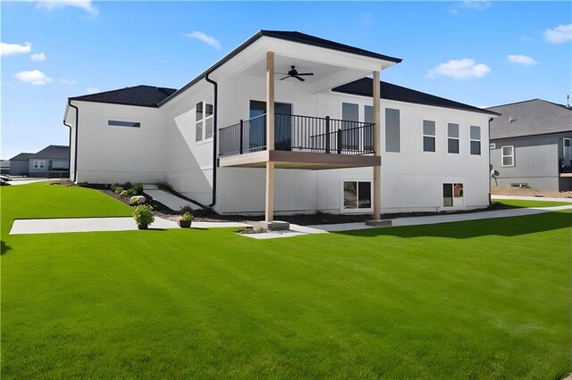 805 W Solomon Dr, Lone Jack, MO 64086 - rear view of house featuring ceiling fan, a balcony, and a lawn