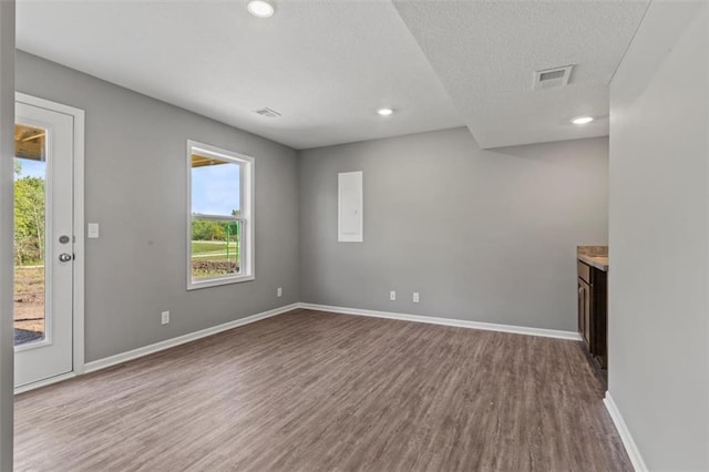 11207 207th St, Peculiar, MO 64078 - unfurnished room featuring wood finished floors, baseboards, and recessed lighting