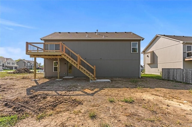 11207 207th St, Peculiar, MO 64078 - rear view of property featuring stairway and a wooden deck