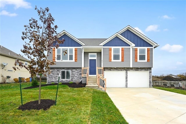 11207 207th St, Peculiar, MO 64078 - view of front of home featuring board and batten siding, stone siding, a garage, concrete driveway, and a front yard
