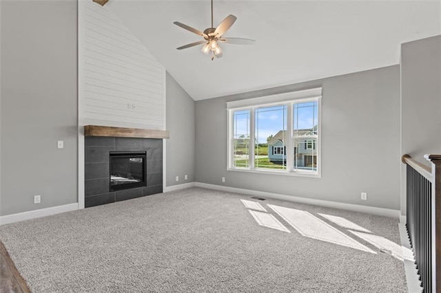 11207 207th St, Peculiar, MO 64078 - unfurnished living room featuring carpet flooring, a fireplace, baseboards, a ceiling fan, and high vaulted ceiling