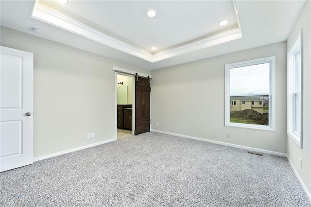 11207 207th St, Peculiar, MO 64078 - unfurnished bedroom featuring multiple windows, a raised ceiling, carpet, ornamental molding, and recessed lighting