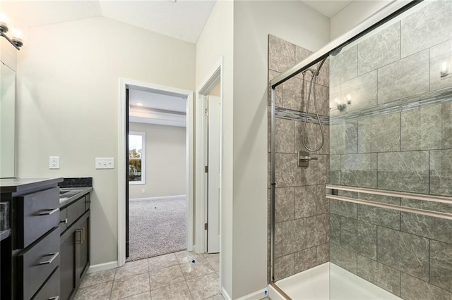 11207 207th St, Peculiar, MO 64078 - bathroom featuring a stall shower, vanity, baseboards, vaulted ceiling, and tile patterned flooring
