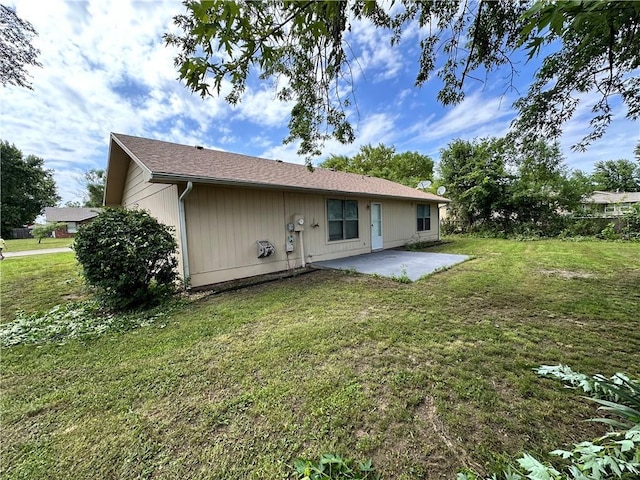 1710 Halsey Ave, Independence, KS 67301 - back of house with a patio area and a yard