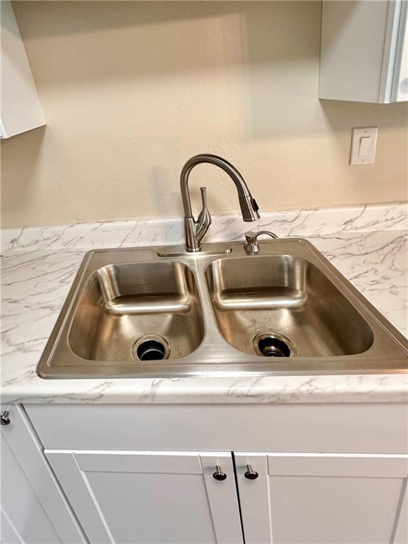 1710 Halsey Ave, Independence, KS 67301 - kitchen view of a sink, light countertops, and white cabinets