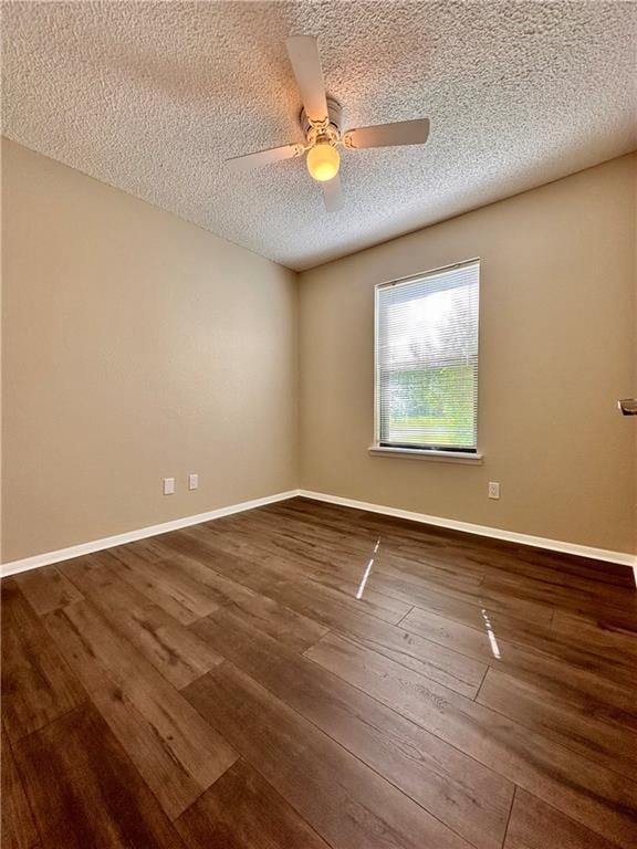 1710 Halsey Ave, Independence, KS 67301 - unfurnished room with a ceiling fan, hardwood / wood-style floors, a textured ceiling, and baseboards