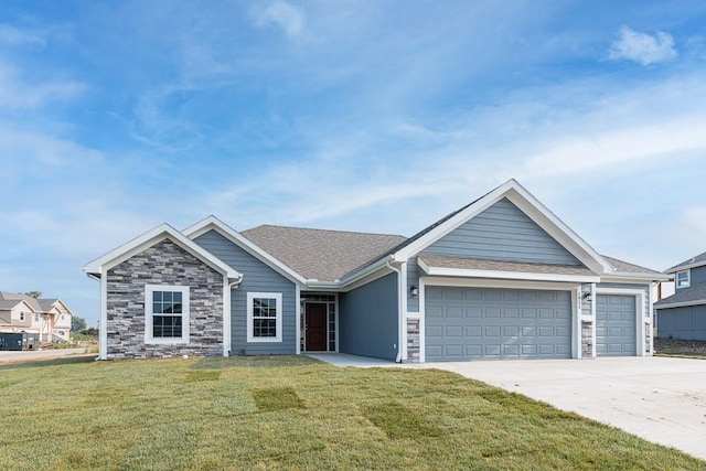 19577 Mitchell Rd, Tonganoxie, KS 66086 - single story home featuring a front lawn, a garage, concrete driveway, and stone siding