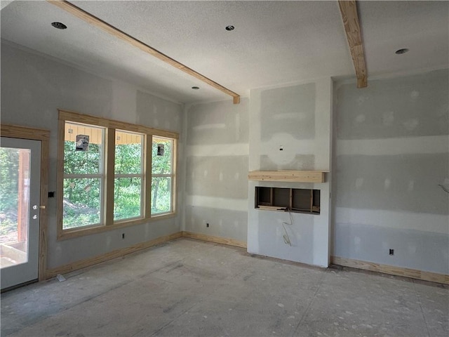 303 SW 17th St, Oak Grove, MO 64029 - unfurnished living room featuring baseboards