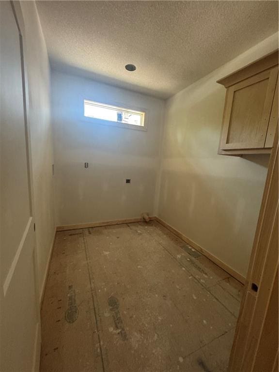 303 SW 17th St, Oak Grove, MO 64029 - empty room featuring a textured ceiling and baseboards