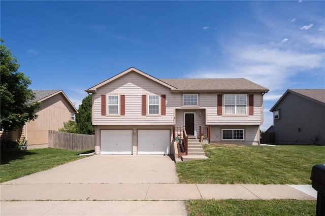 706 E 15th St E, Eudora, KS 66025 - raised ranch with driveway and an attached garage