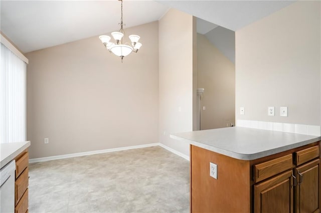 706 E 15th St E, Eudora, KS 66025 - kitchen featuring a chandelier, lofted ceiling, light countertops, dishwasher, and baseboards