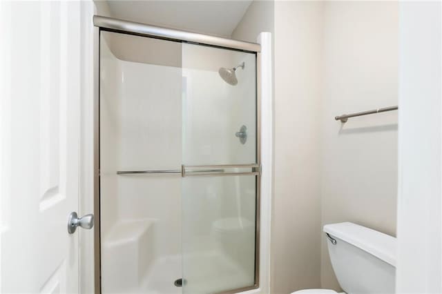 706 E 15th St E, Eudora, KS 66025 - full bathroom with a stall shower and toilet