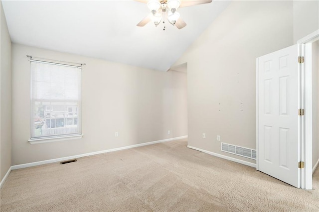 706 E 15th St E, Eudora, KS 66025 - carpeted spare room featuring a ceiling fan, baseboards, and lofted ceiling