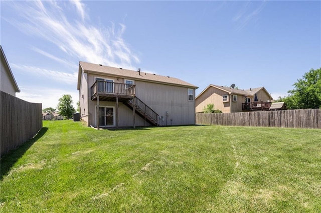 706 E 15th St E, Eudora, KS 66025 - rear view of house with stairway, a deck, and central air condition unit