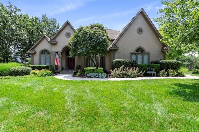 15141 Windsor Cir, Leawood, KS 66224 - french country inspired facade with stucco siding and a front lawn