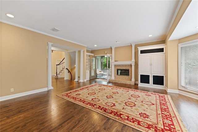 15141 Windsor Cir, Leawood, KS 66224 - living room with stairs, crown molding, wood finished floors, a fireplace, and recessed lighting