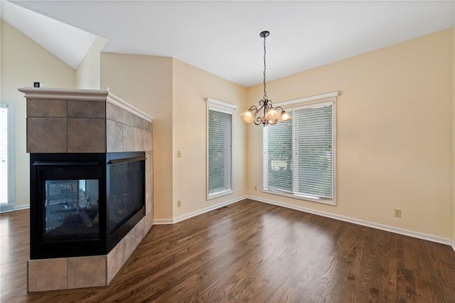 15141 Windsor Cir, Leawood, KS 66224 - unfurnished living room with a chandelier, a multi sided fireplace, and dark wood-style floors