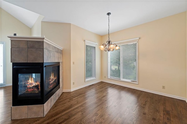 15141 Windsor Cir, Leawood, KS 66224 - unfurnished living room featuring a multi sided fireplace, a chandelier, and dark wood finished floors