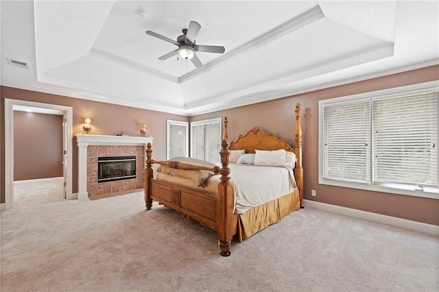 15141 Windsor Cir, Leawood, KS 66224 - bedroom with a tray ceiling, multiple windows, and light carpet