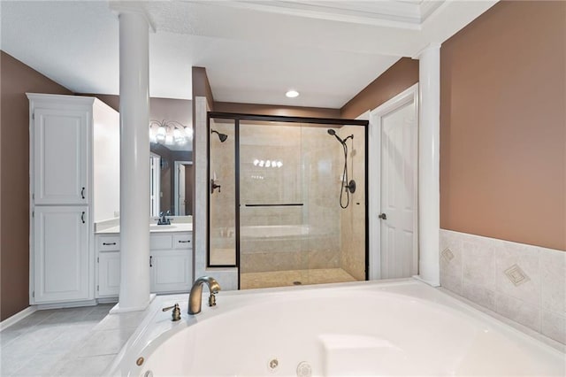 15141 Windsor Cir, Leawood, KS 66224 - bathroom with a whirlpool tub, vanity, a shower stall, and ornate columns