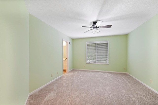 15141 Windsor Cir, Leawood, KS 66224 - empty room with light colored carpet and a ceiling fan