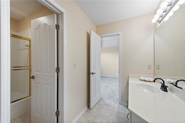 15141 Windsor Cir, Leawood, KS 66224 - bathroom with vanity, bath / shower combo with glass door, and a textured ceiling
