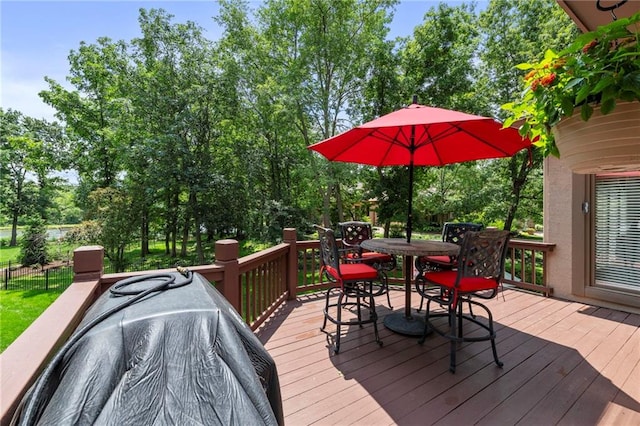15141 Windsor Cir, Leawood, KS 66224 - wooden deck featuring outdoor dining area and view of scattered trees