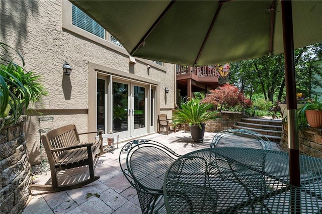 15141 Windsor Cir, Leawood, KS 66224 - view of patio / terrace featuring french doors and outdoor dining area