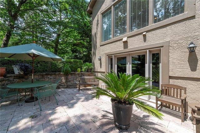 15141 Windsor Cir, Leawood, KS 66224 - view of patio featuring french doors and outdoor dining area
