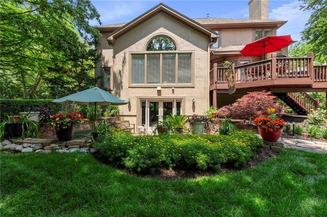 15141 Windsor Cir, Leawood, KS 66224 - rear view of house with stucco siding, a wooden deck, a chimney, french doors, and stairs