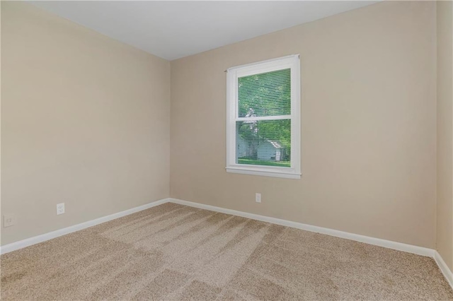 707 N Delaware St, Butler, MO 64730 - unfurnished room with carpet floors and baseboards