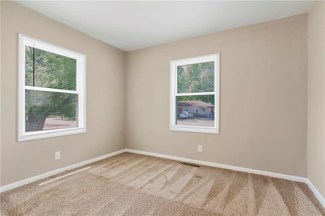 707 N Delaware St, Butler, MO 64730 - empty room with carpet floors and baseboards