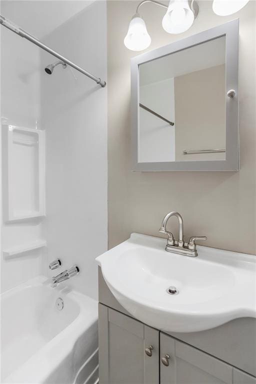 707 N Delaware St, Butler, MO 64730 - bathroom featuring vanity and shower / bathtub combination
