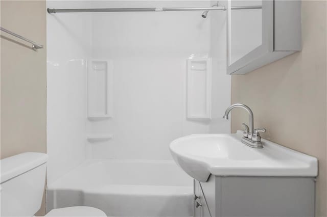 707 N Delaware St, Butler, MO 64730 - full bath with vanity, toilet, and shower / washtub combination