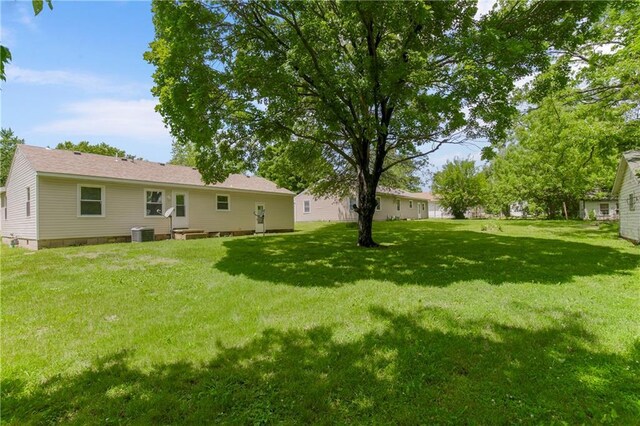 707 N Delaware St, Butler, MO 64730 - view of green lawn with central air condition unit
